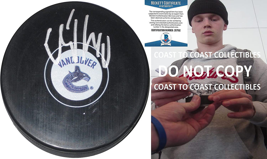 Elias Pettersson signed Vancouver Canucks logo Hockey Puck proof Beckett COA autographed