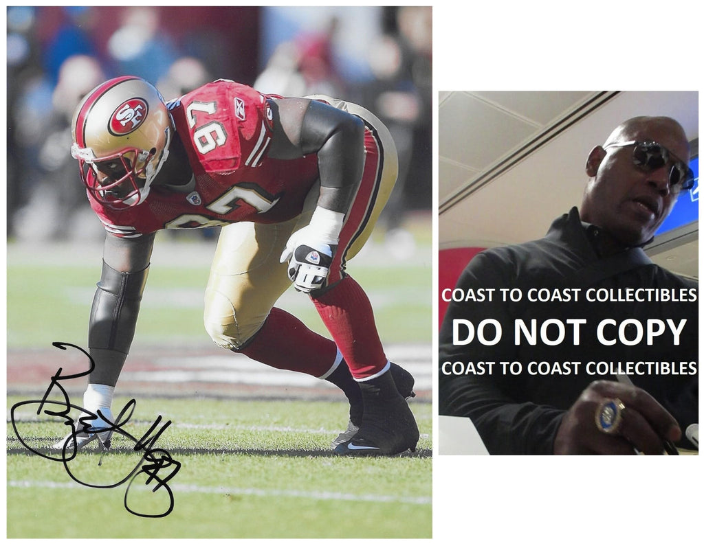 Bryant Young signed San Francisco 49ers football 8x10 photo proof COA autographed..