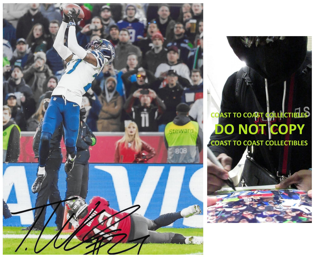 Tariq Woolen signed Seattle Seahawks football 8x10 photo proof COA autographed.