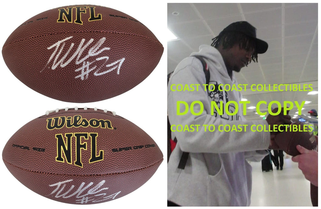Tariq Woolen Seattle Seahawks signed NFL football COA exact proof autographed.