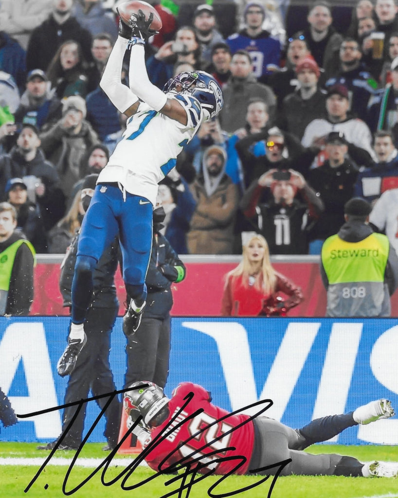 Tariq Woolen signed Seattle Seahawks football 8x10 photo proof COA autographed.